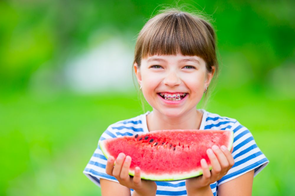 Learn more about the benefits of starting your child in braces over their summer break.