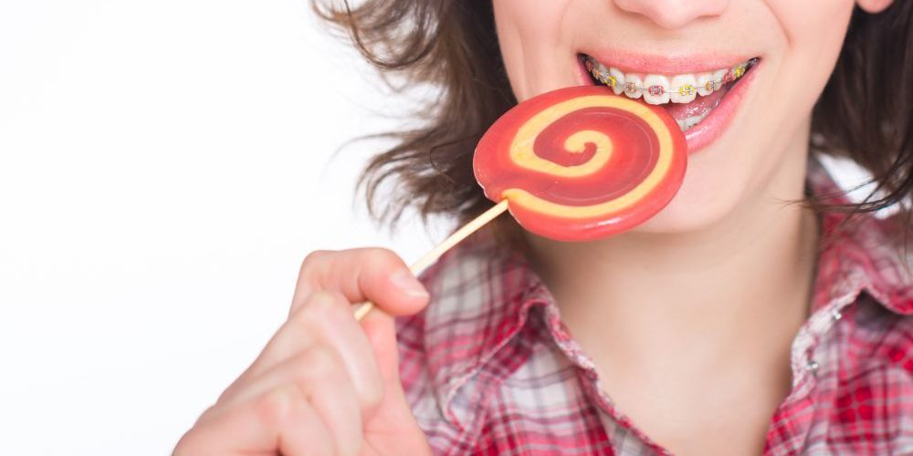 Boy eating with braces